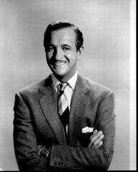 David Niven smiling in a suit, black and white photo print.