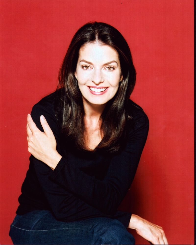 Sela Ward photo print in black with a red background, elegant portrait.