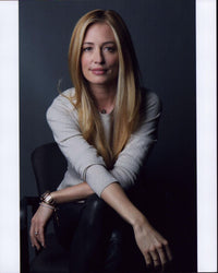 Cat Deeley in leather pants and gray top photo print