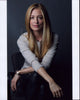 Cat Deeley in leather pants and gray top photo print