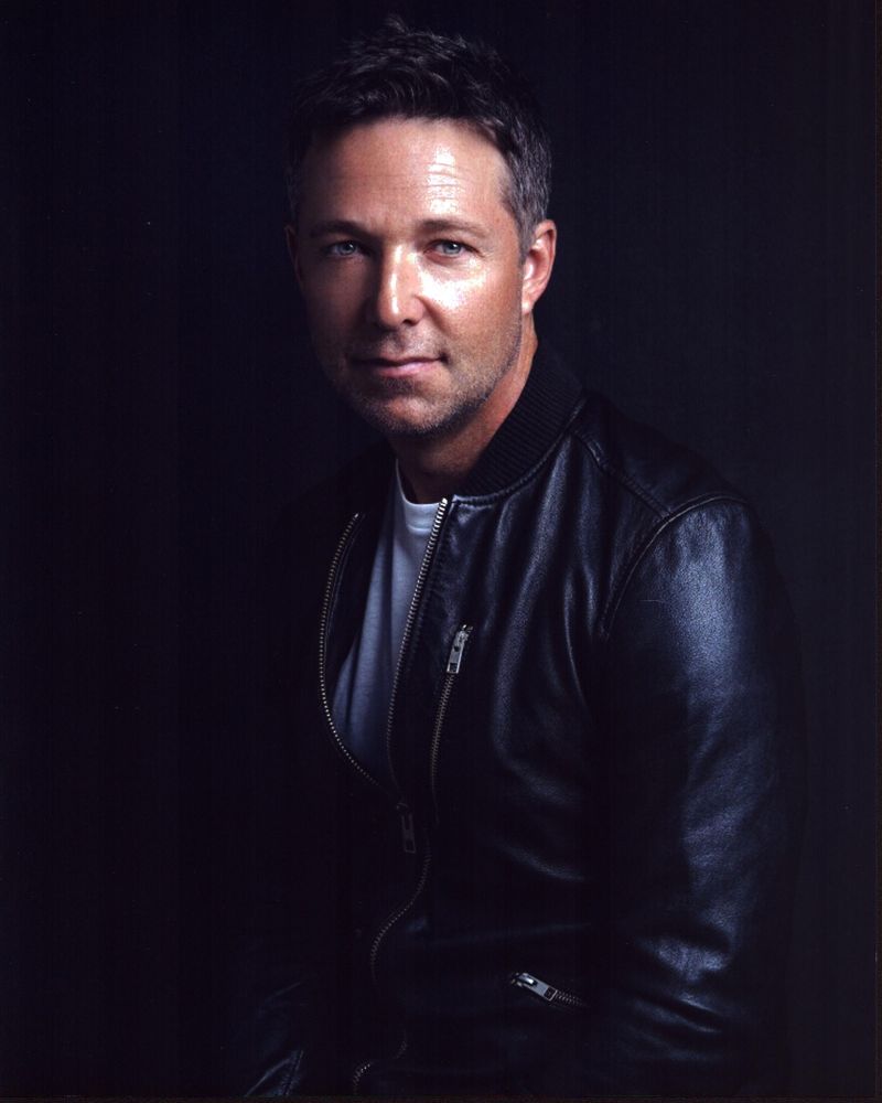 George Newbern photo print in leather jacket, stylish and charismatic.