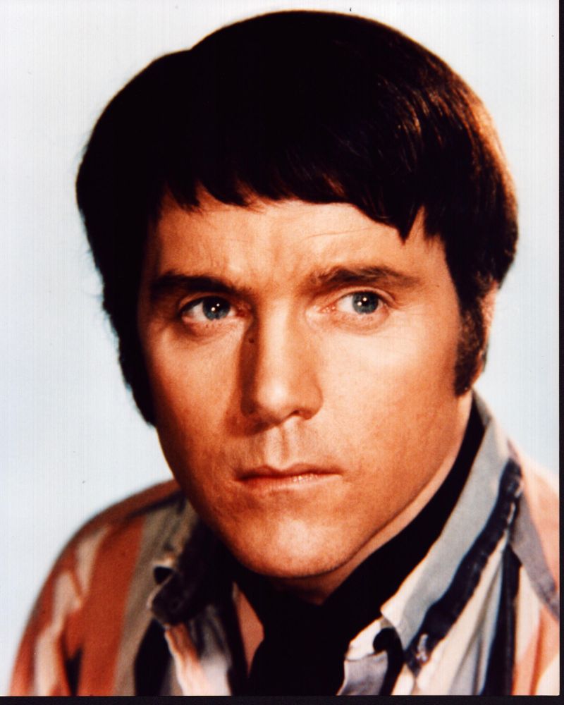 Kenneth Cope headshot photo print in striped shirt.