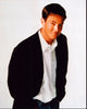 Matthew Perry stylish photo print in blazer with hands in pockets.
