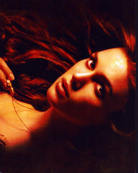 Keira Knightley holding a necklace in Pirates of the Caribbean photo print.