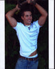 Paul Vandervort photo print with arms raised in a casual pose.
