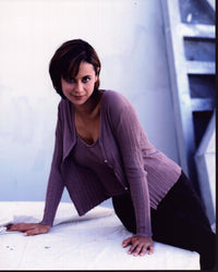 Catherine Bell in a purple sweater set photo print.