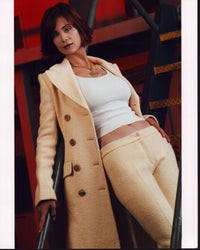 Catherine Bell On Stairs in Tan Jacket Photo Print