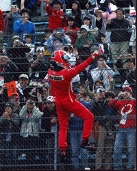 Helio Castroneves Climbing Fence Photo Print celebrating victory.
