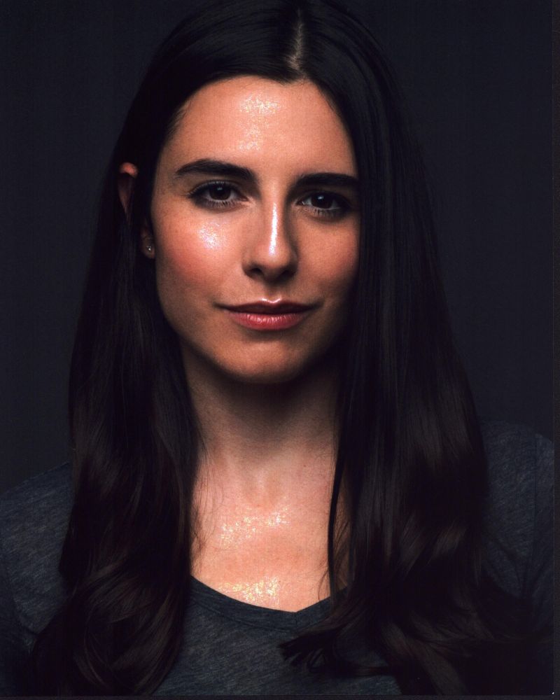 Marianne Rendón headshot photo print in gray top