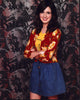 Laura Marano photo print in denim skirt and floral sweater