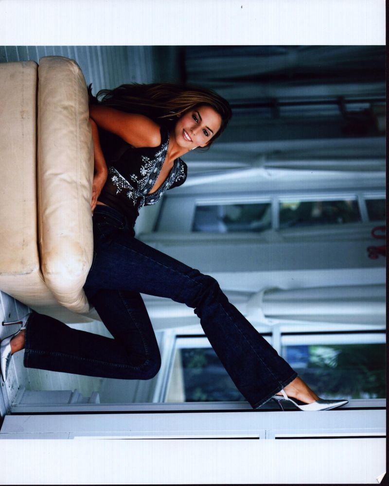 Genesis Rodriguez stylish photo print in jeans, perfect for home decor.