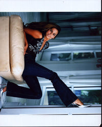 Genesis Rodriguez stylish photo print in jeans, perfect for home decor.
