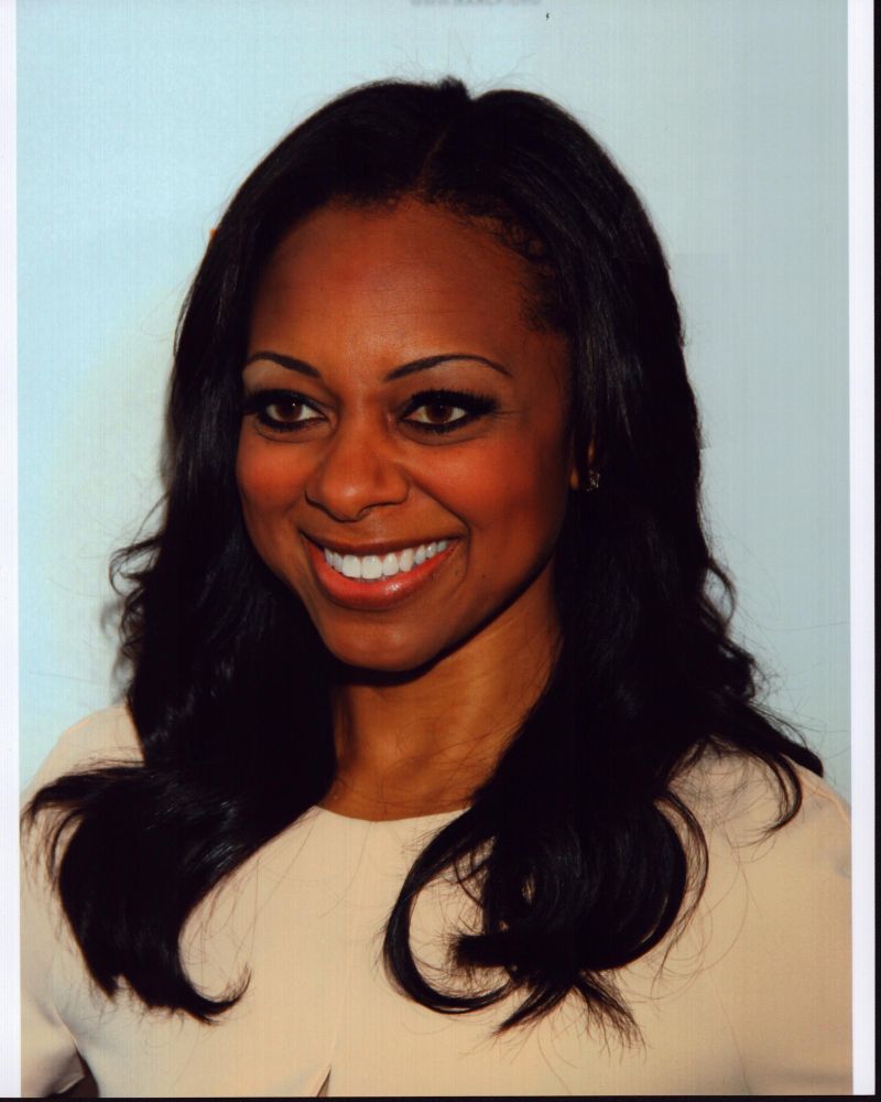 Close-up photo print of Nischelle Turner in a tan top.