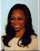 Close-up photo print of Nischelle Turner in a tan top.