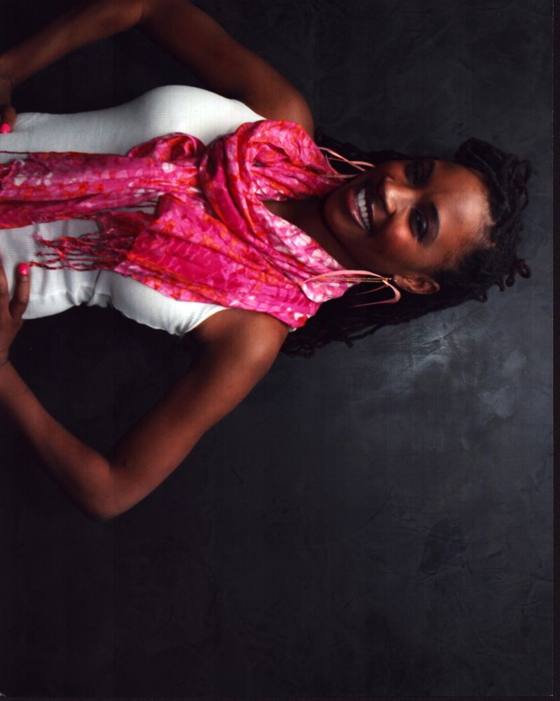 Shanola Hampton photo print with pink scarf and hands on hips