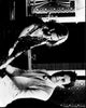 Black and white photo print of Nicole Kidman and Robbie Williams holding hands in Something Stupid music video