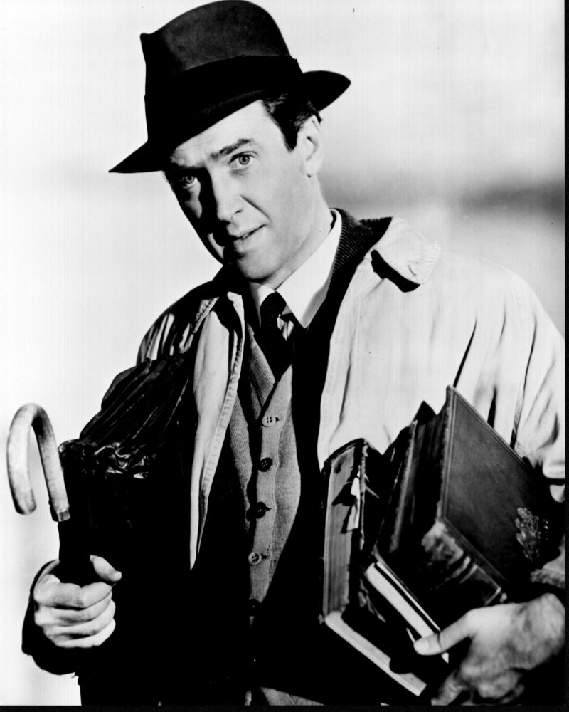 James Stewart holding books and umbrella in Harvey black and white photo print.