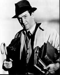 James Stewart holding books and umbrella in Harvey black and white photo print.