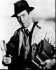 James Stewart holding books and umbrella in Harvey black and white photo print.
