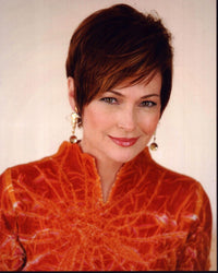 Carolyn Hennesy photo print in orange top, vibrant colors.
