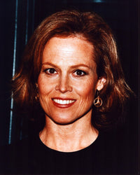 Close-up photo print of Sigourney Weaver in black top and gold earrings.