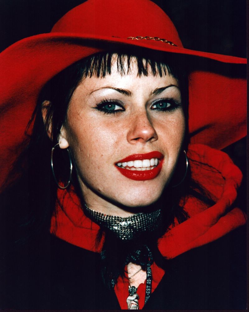 Fairuza Balk close-up photo print featuring a black outfit and red hat.