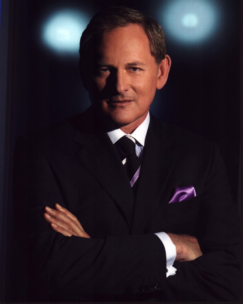 Victor Garber portrait photo print in a suit with arms crossed.