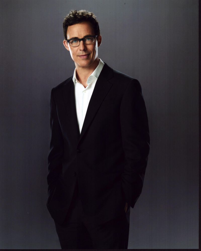 Tom Cavanagh in black suit and white shirt photo print.