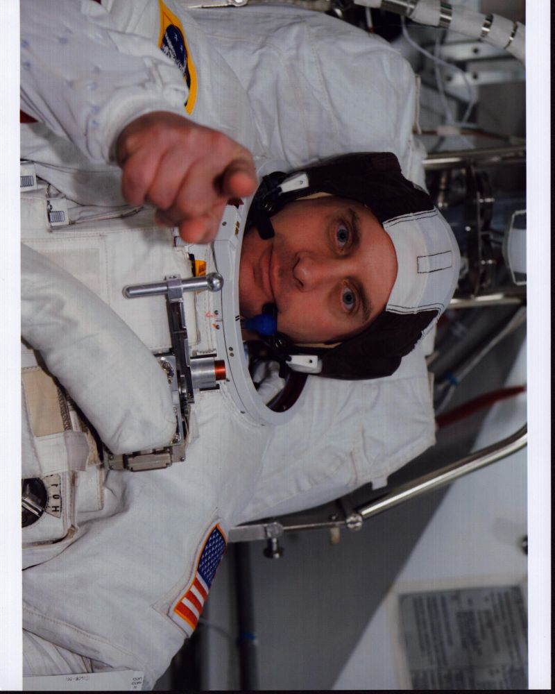 Garrett Reisman pointing in astronaut gear photo print.