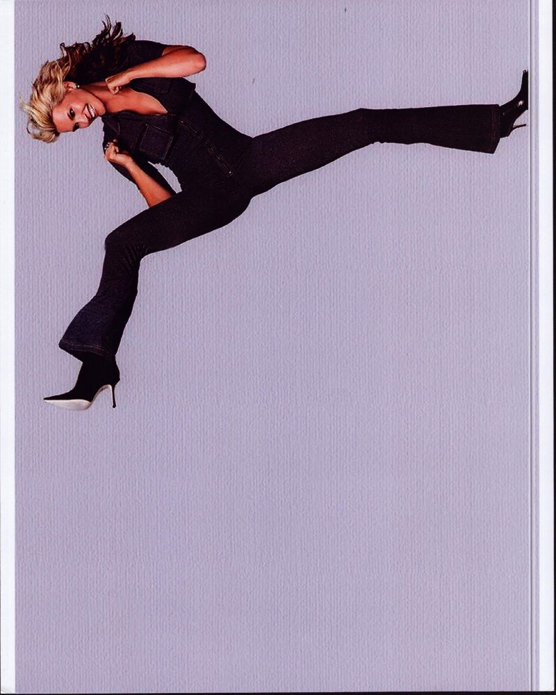 Natasha Henstridge in denim jumpsuit photo print