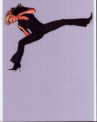Natasha Henstridge in denim jumpsuit photo print