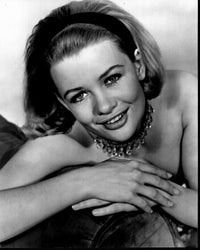 Judy Geeson leaning on arm of couch black and white photo print.