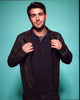 James Wolk photo print wearing a leather jacket against a blue background.