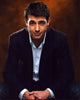 James Wolk leaning forward in jeans and blazer photo print