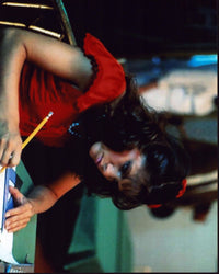 Photo print of Donna Wilkes doing school work in Angel.