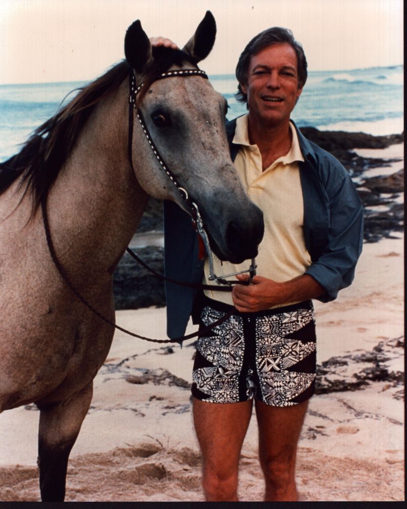 Richard Chamberlain on the beach with a horse photo print