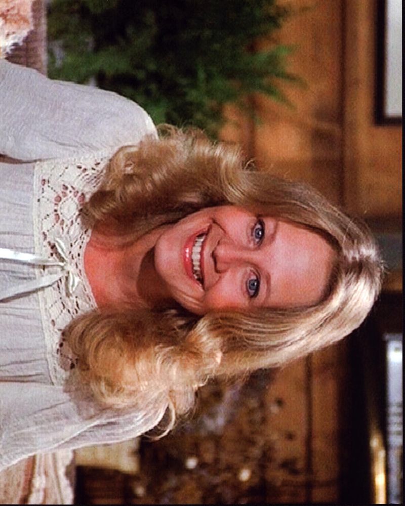 Sandra Kerns smiling in a white lace top photo print