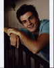 Beau Mirchoff Leaning On Railing Photo Print showcasing vibrant colors.