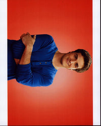 Beau Mirchoff photo print with arms crossed in blue long sleeve shirt