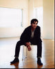 Matt Bomer leaning forward in chair photo print.