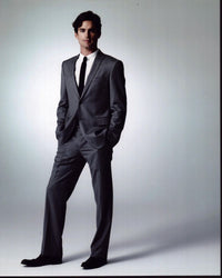 Matt Bomer photo print in gray suit with hands in pockets.
