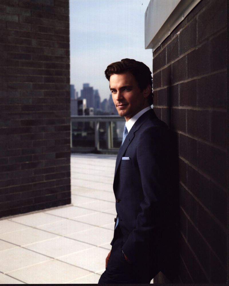 Matt Bomer leaning on wall rooftop photo print