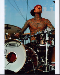 Travis Barker Playing Drums in Red Hat Photo Print