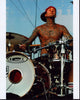 Travis Barker Playing Drums in Red Hat Photo Print
