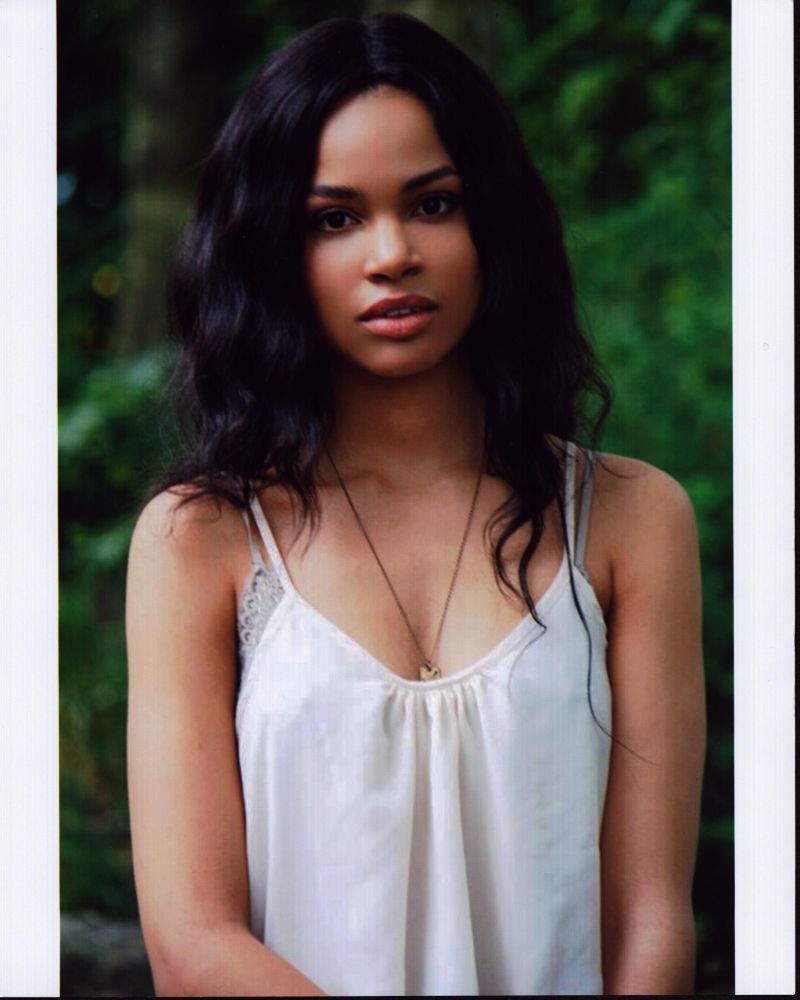 Nesta Cooper photo print in white tank top, stylish and elegant.