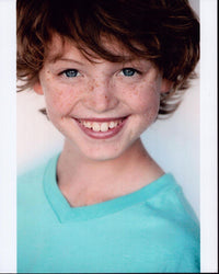 Kyle Red Silverstein headshot photo print in blue shirt.
