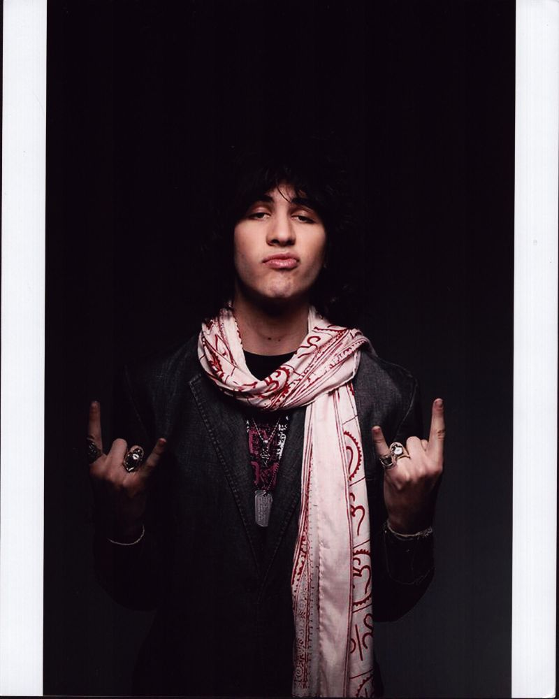 Nick Simmons With Scarf Photo Print showcasing a stylish pose.