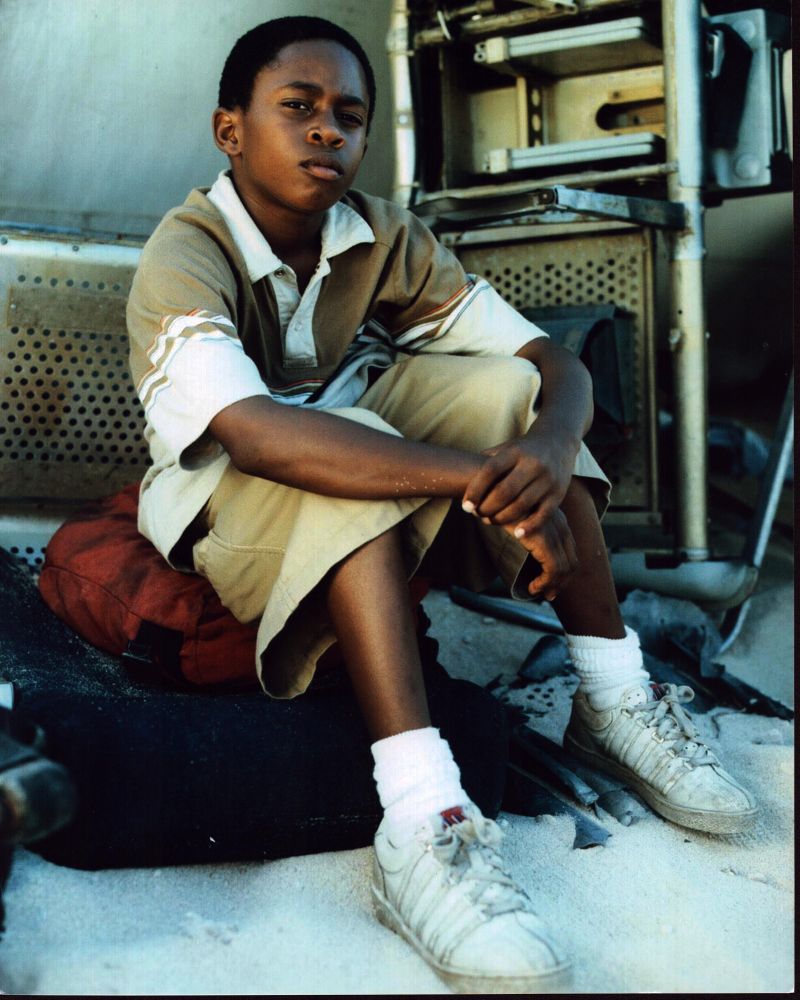 Malcolm David Kelley Sitting With Plane Wreckage Photo Print