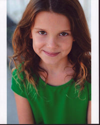 Millie Bobby Brown portrait photo print in green top.