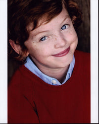 Kyle Red Silverstein headshot photo print in red sweater